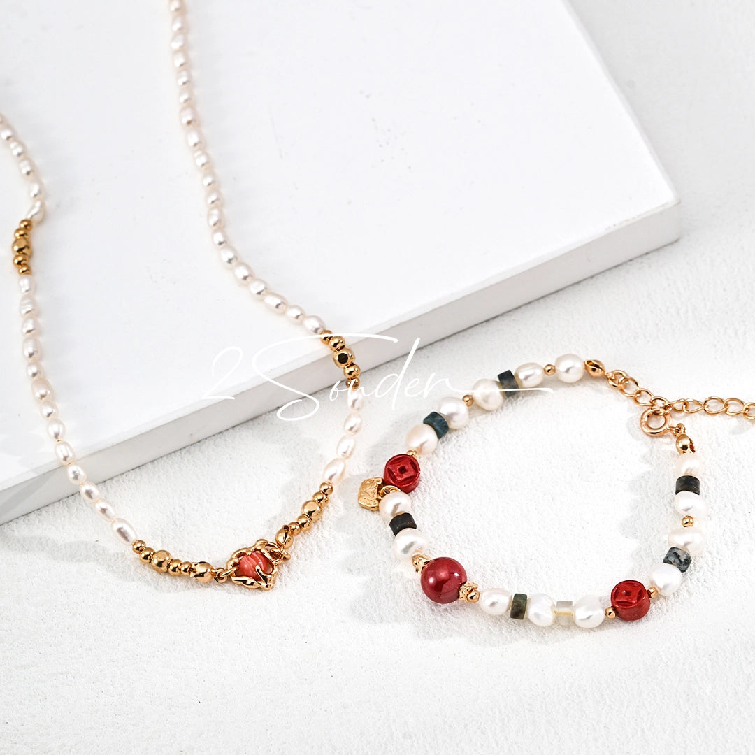 This is a bracelet made of S925 sterling silver, red cinnabars, green moss agates and natural white pearls. It's 16cm long with a 3cm extended chain. It comes with a lobster clasp which is easy to be used.