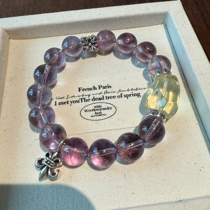 This is a crystal bracelet that consists of amethyst, citrine and chrome hearts spacers.