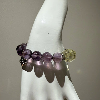 This is a crystal bracelet that consists of amethyst, citrine and chrome hearts spacers.