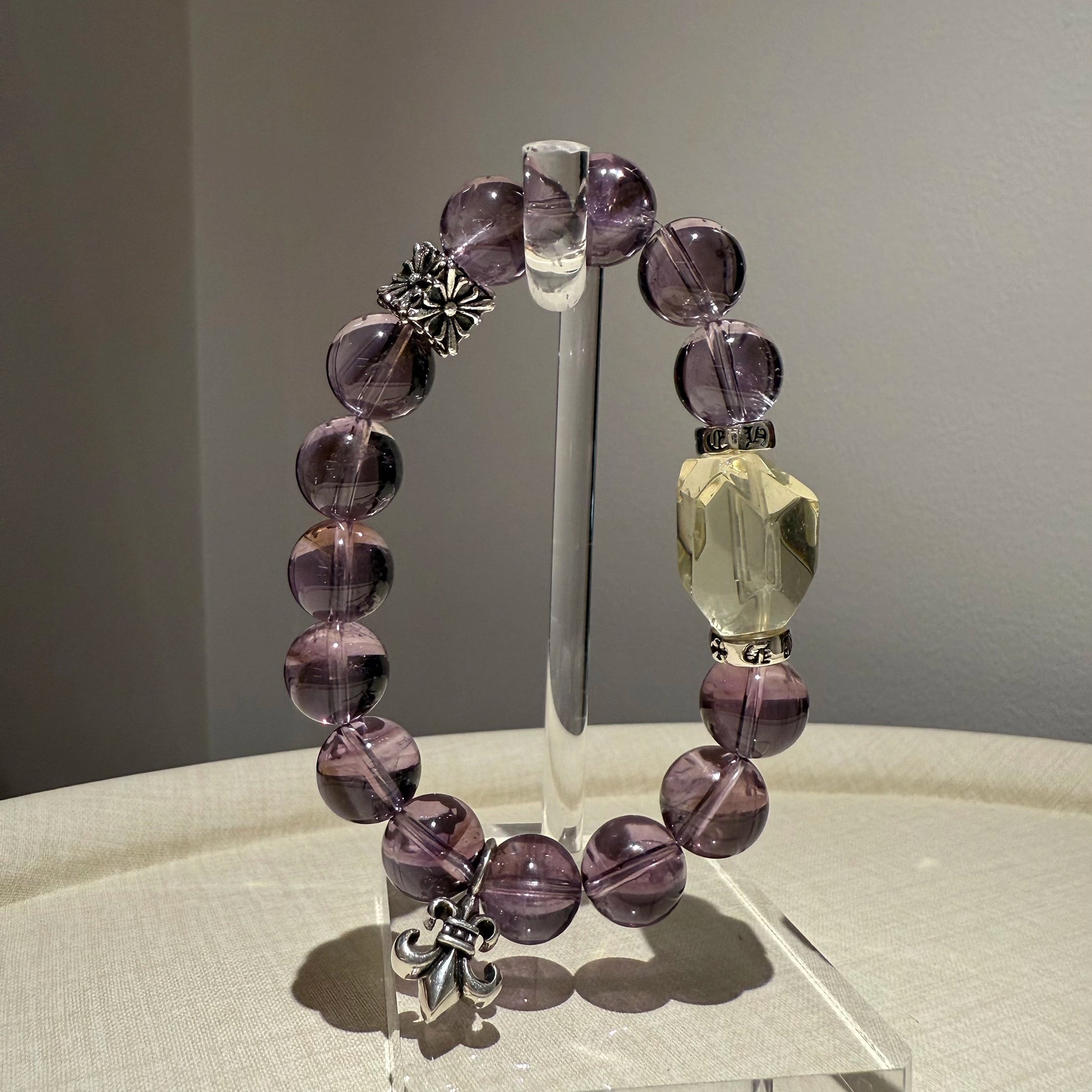 This is a crystal bracelet that consists of amethyst, citrine and chrome hearts spacers.