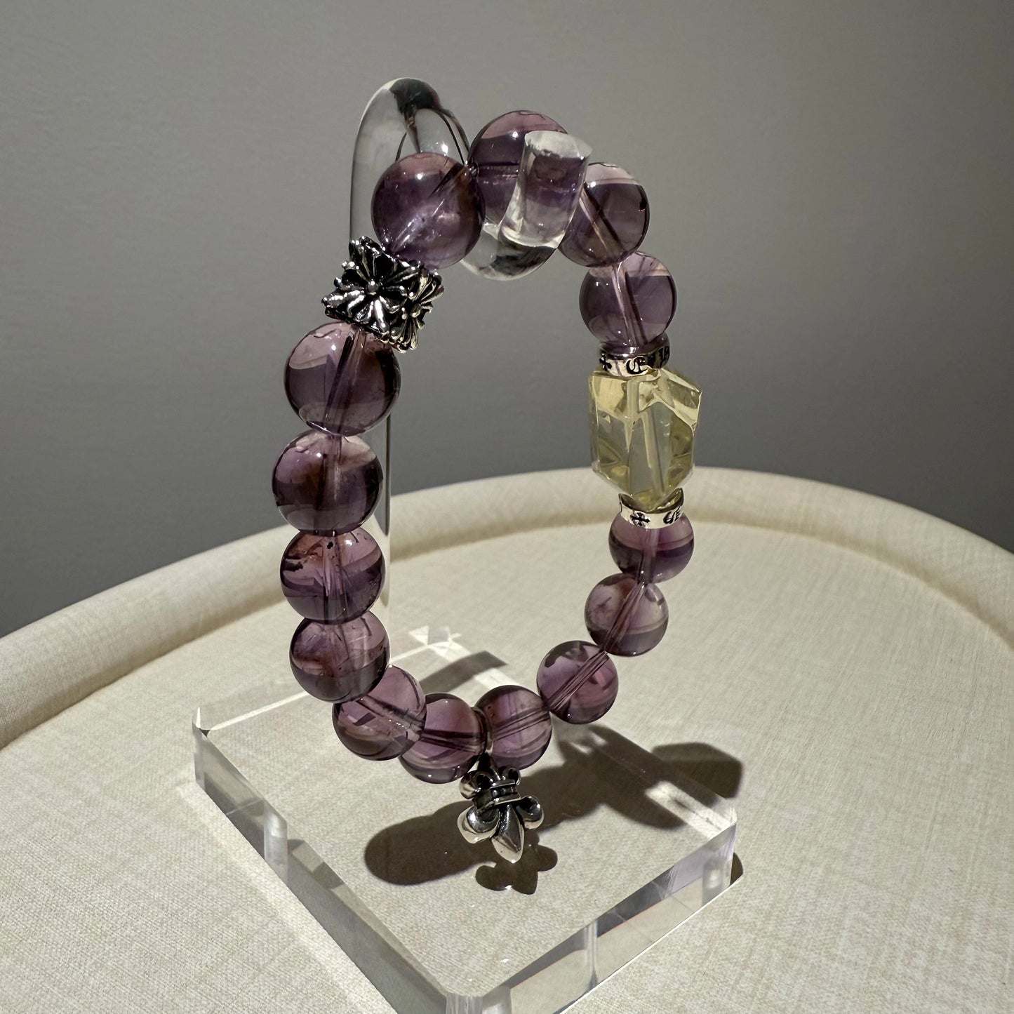 This is a crystal bracelet that consists of amethyst, citrine and chrome hearts spacers.
