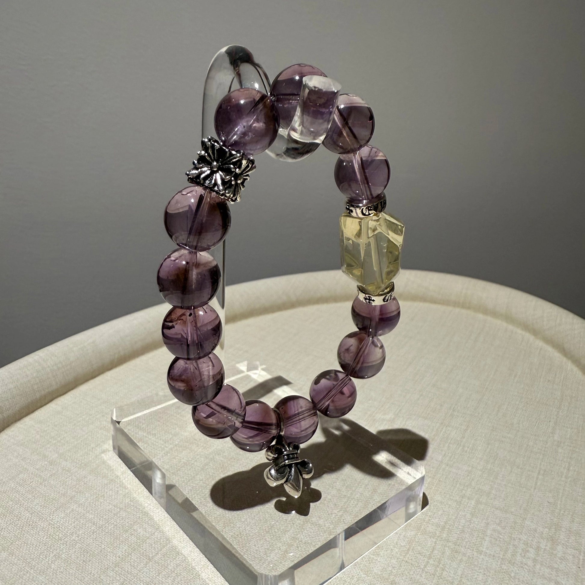 This is a crystal bracelet that consists of amethyst, citrine and chrome hearts spacers.