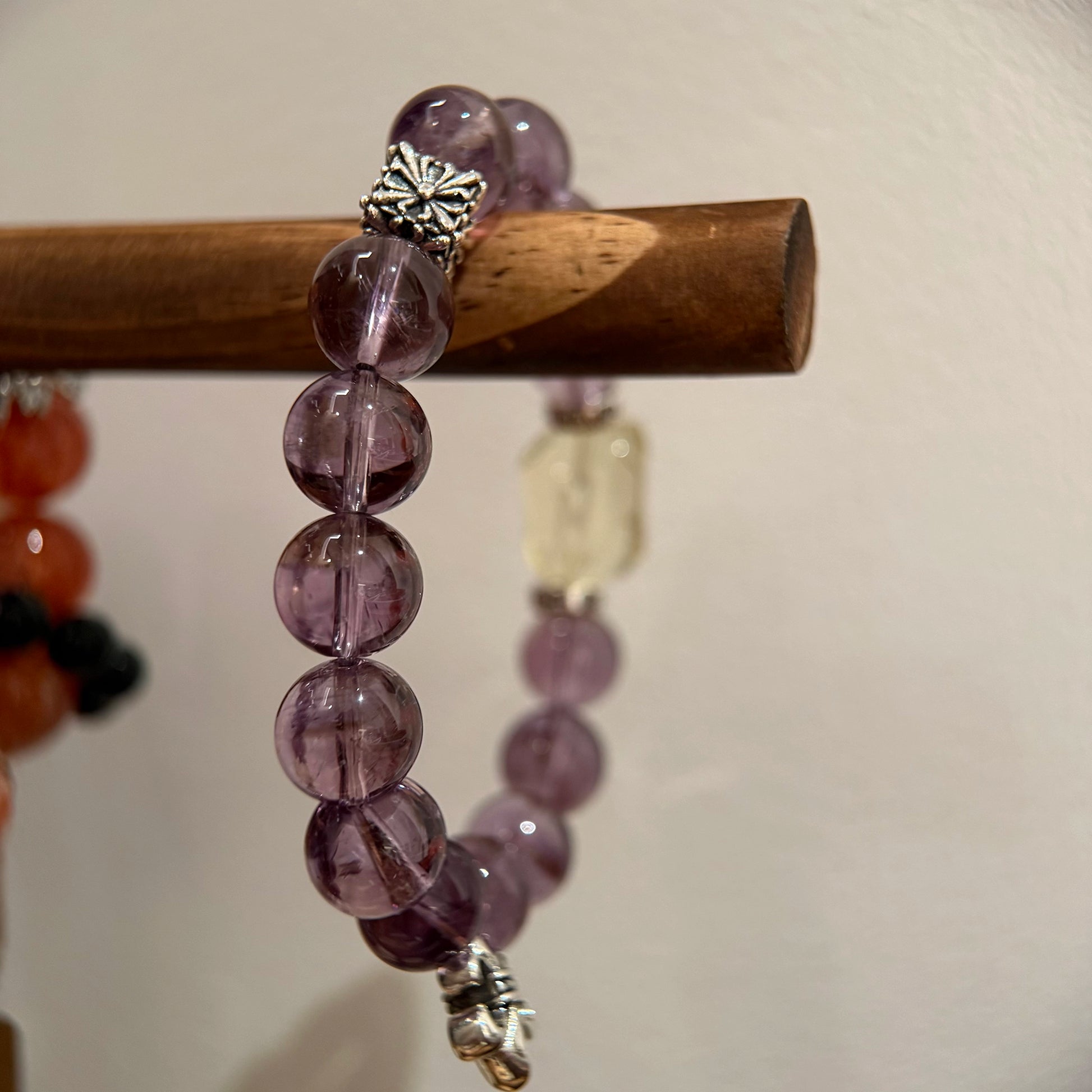 This is a crystal bracelet that consists of amethyst, citrine and chrome hearts spacers.
