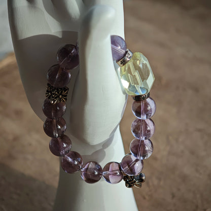 This is a crystal bracelet that consists of amethyst, citrine and chrome hearts spacers.