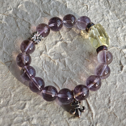 This is a crystal bracelet that consists of amethyst, citrine and chrome hearts spacers.