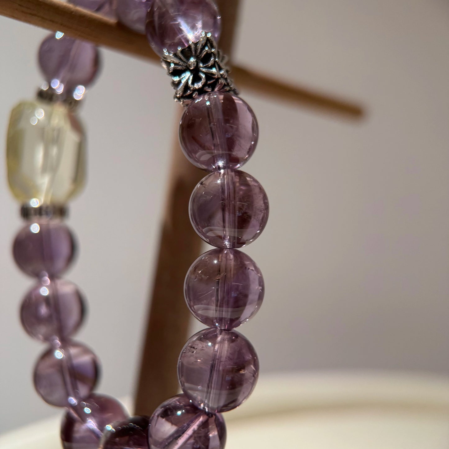 This is a crystal bracelet that consists of amethyst, citrine and chrome hearts spacers.