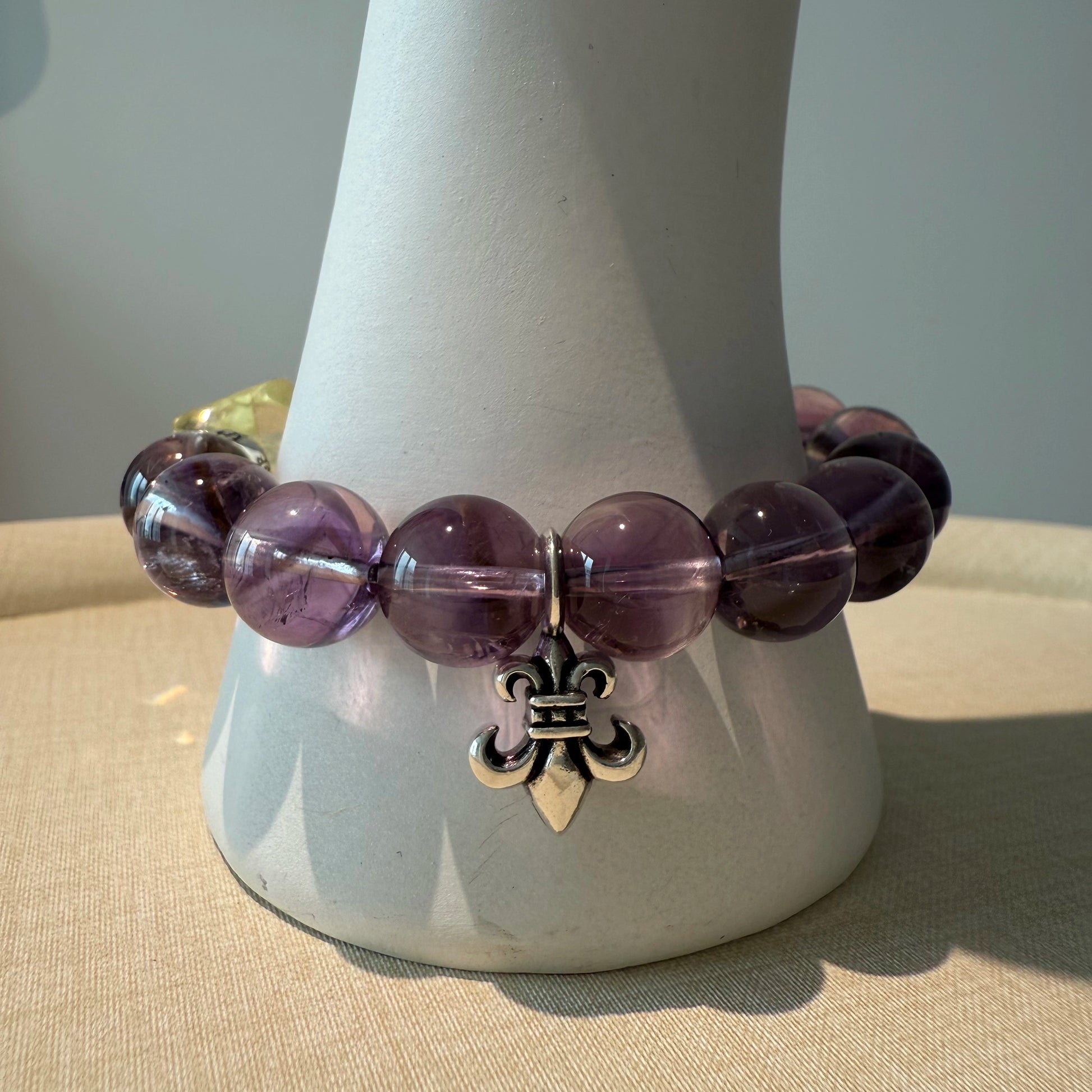 This is a crystal bracelet that consists of amethyst, citrine and chrome hearts spacers.