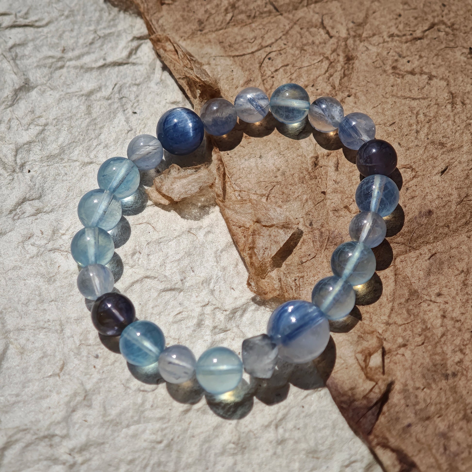 This is a gemstone bracelet consists of Kyanite, Blue Velvet Stone, Aquamarine, and Cordierite.