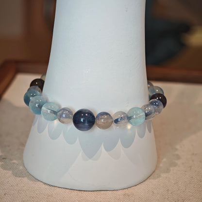 This is a gemstone bracelet consists of Kyanite, Blue Velvet Stone, Aquamarine, and Cordierite.