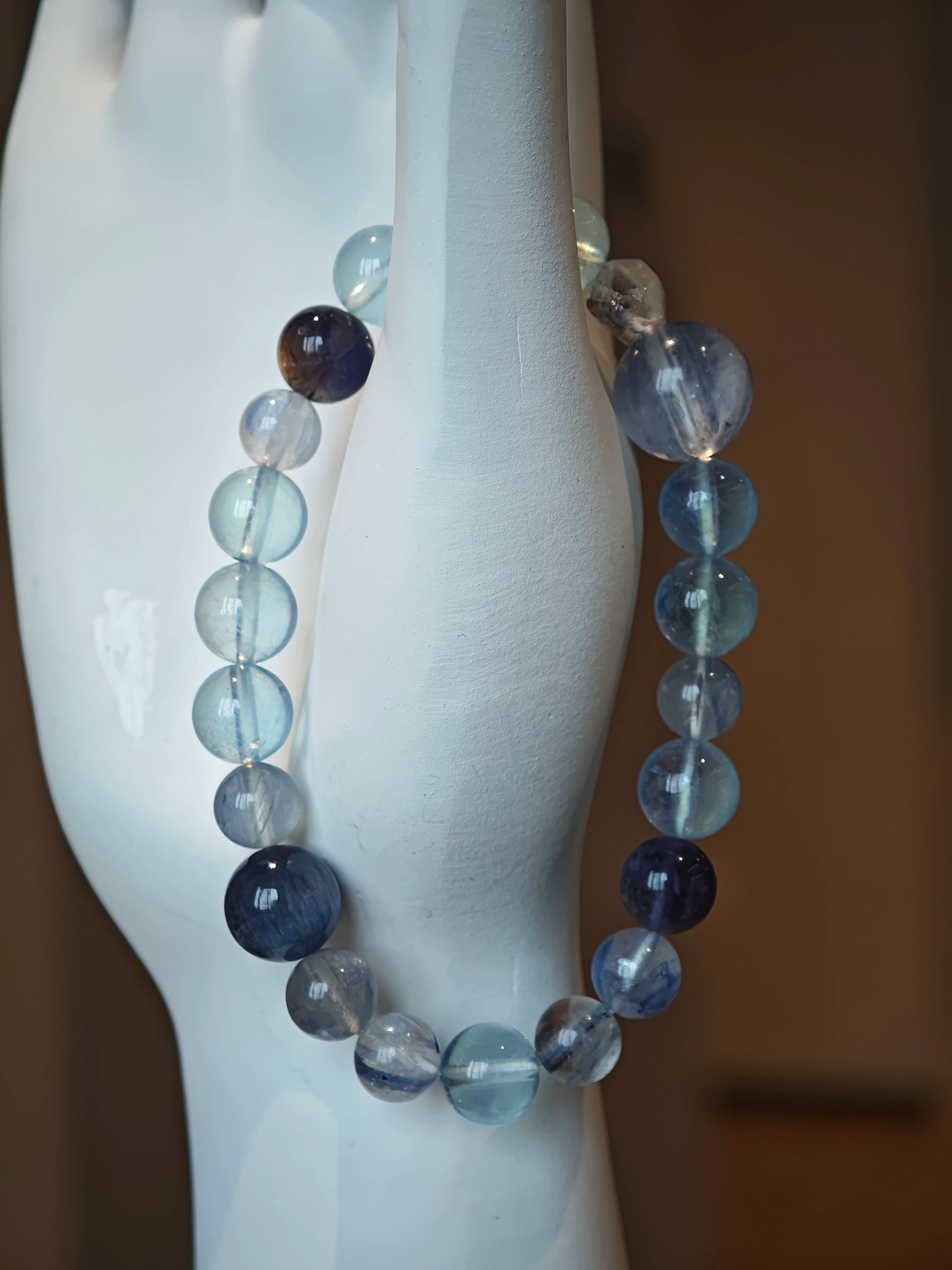 This is a gemstone bracelet consists of Kyanite, Blue Velvet Stone, Aquamarine, and Cordierite.