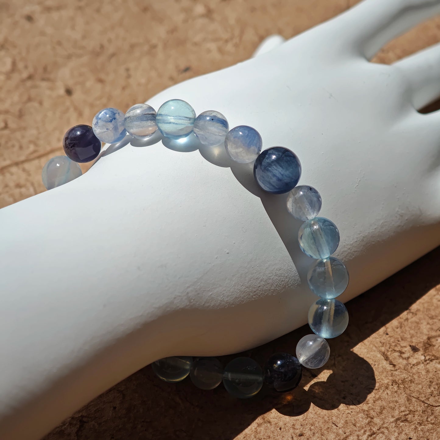 This is a gemstone bracelet consists of Kyanite, Blue Velvet Stone, Aquamarine, and Cordierite.
