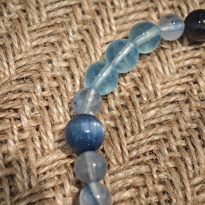 This is a gemstone bracelet consists of Kyanite, Blue Velvet Stone, Aquamarine, and Cordierite.