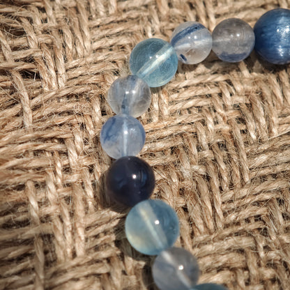 This is a gemstone bracelet consists of Kyanite, Blue Velvet Stone, Aquamarine, and Cordierite.