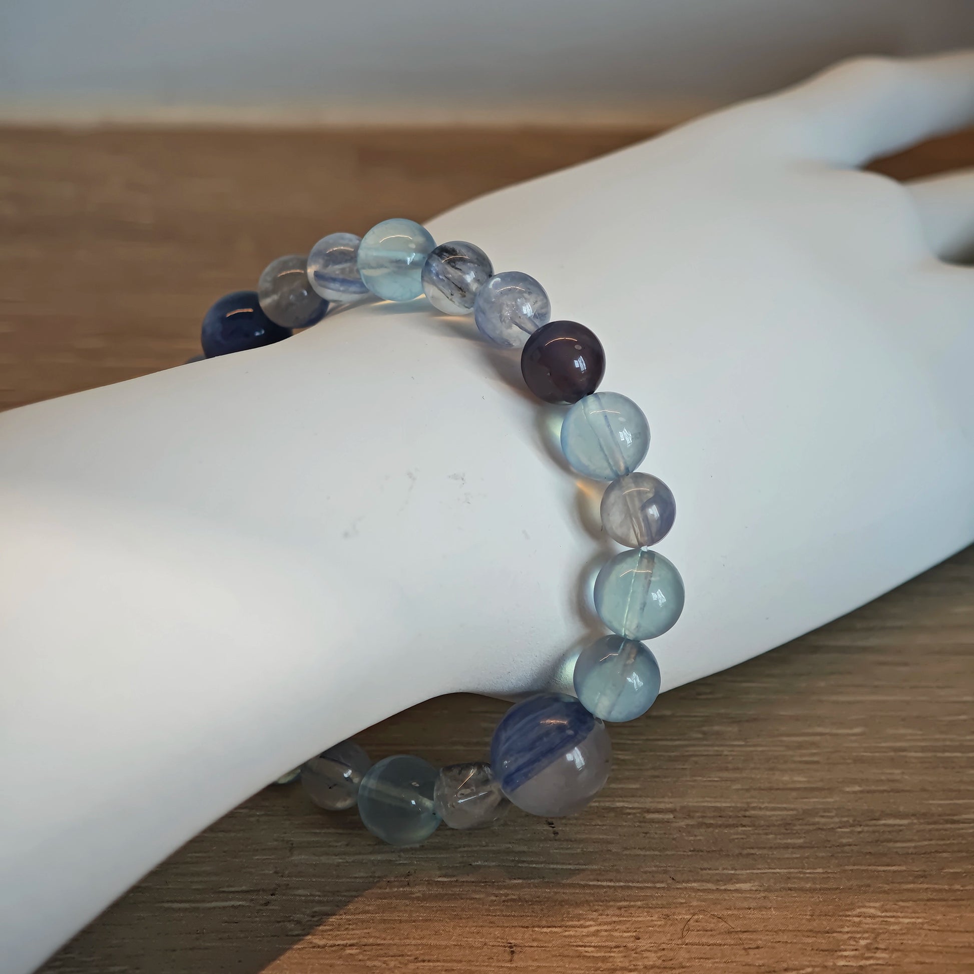 This is a gemstone bracelet consists of Kyanite, Blue Velvet Stone, Aquamarine, and Cordierite.