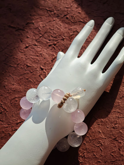 This crystal band pairs Rose Quartz with White Phantom Quartz and a hopping agate rabbit accent.