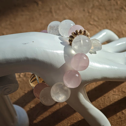 Gentle Rose Quartz, dreamy White Phantom Quartz, and an agate bunny glide together on this strand.