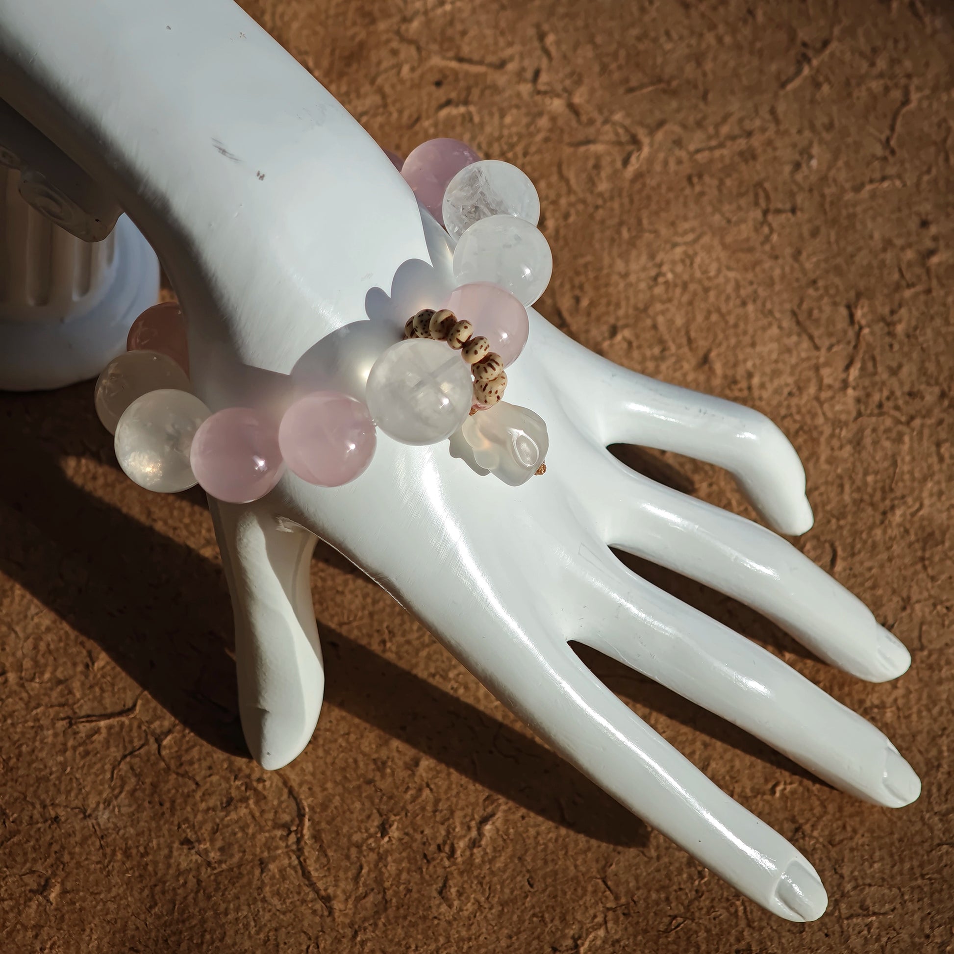 This bracelet blends soft Rose Quartz, White Phantom Quartz, and a playful agate rabbit bead.