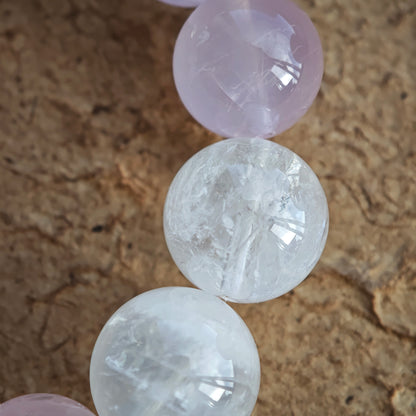 Feel Rose Quartz, White Phantom Quartz, and an agate rabbit bead dancing on your skin.