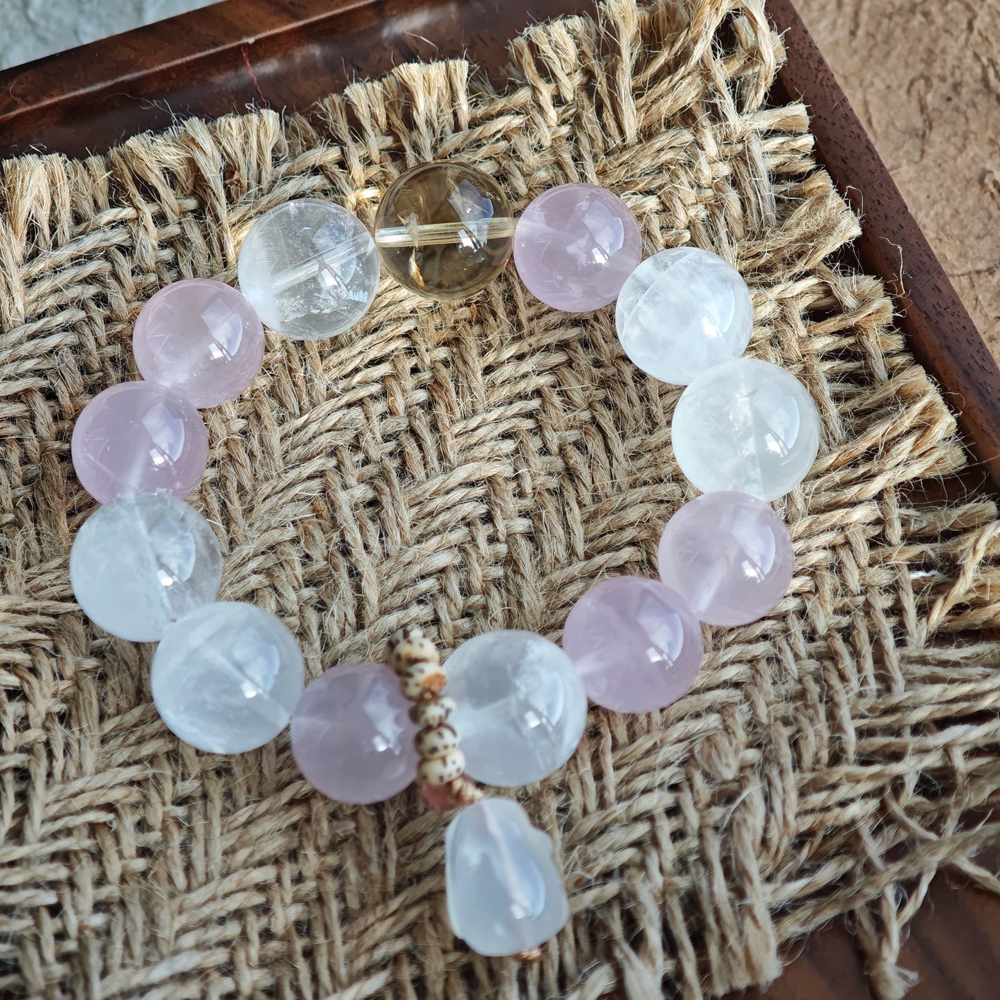 Rose Quartz warmth, White Phantom Quartz light, and an agate rabbit charm complete this piece.