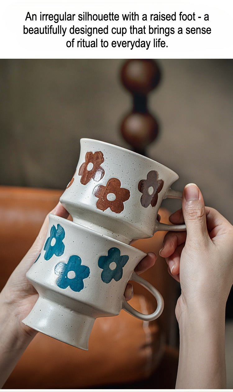 This is a 300ml ceramic goblet mug with hand-painted leaf or flower patterns and a matte sesame-speckled glaze design. With mouth diameter of 9.7, bottom diameter of 6.7cm and height of 10.5cm, this mug is ideal for coffee, milk, water, or oatmeal during slow mornings or quiet afternoons.