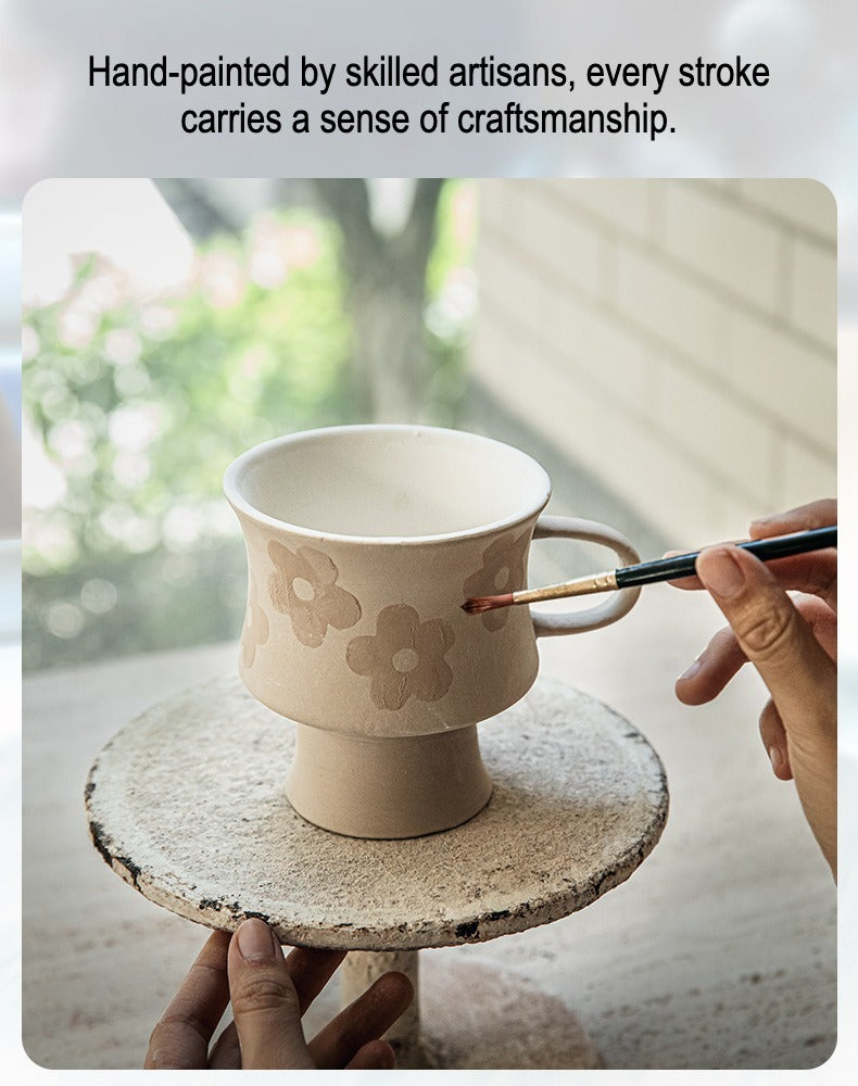 This is a 300ml ceramic goblet mug with hand-painted leaf or flower patterns and a matte sesame-speckled glaze design. With mouth diameter of 9.7, bottom diameter of 6.7cm and height of 10.5cm, this mug is ideal for coffee, milk, water, or oatmeal during slow mornings or quiet afternoons.
