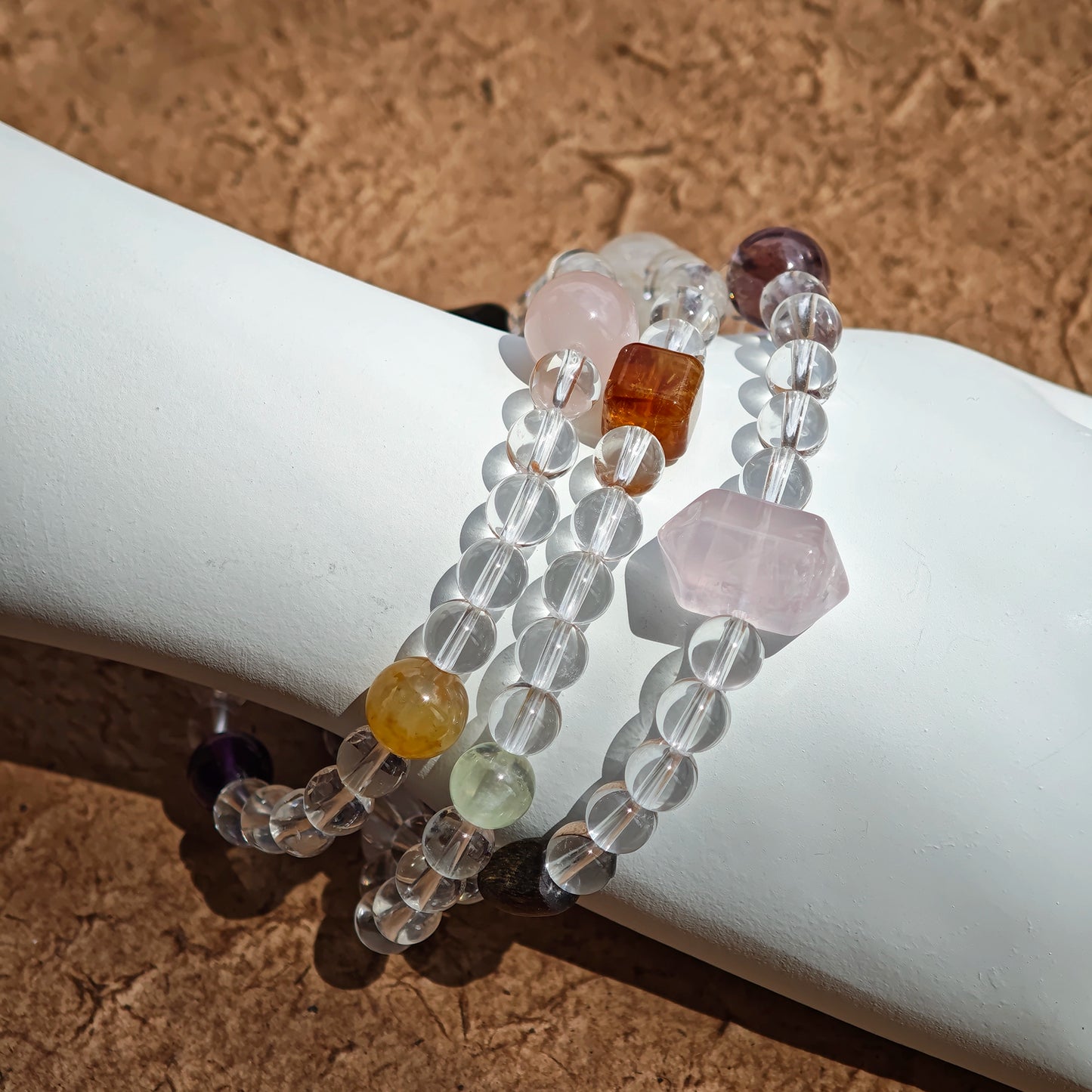A multi-gemstone bracelet which is made with Silver Sheen Obsidian, Clear Quartz, Amethyst, Rose Quartz, Kyanite, Citrine, and Prehnite, etc. It’s also a necklace.