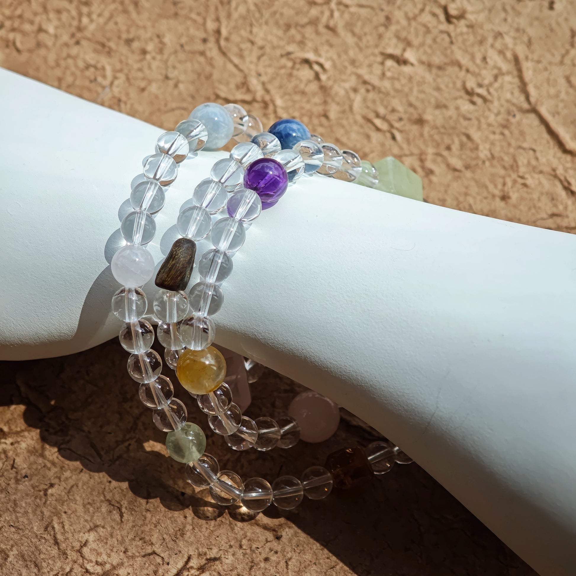 A multi-gemstone bracelet which is made with Silver Sheen Obsidian, Clear Quartz, Amethyst, Rose Quartz, Kyanite, Citrine, and Prehnite, etc. It’s also a necklace.