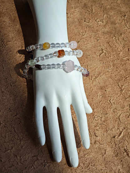 A multi-gemstone bracelet which is made with Silver Sheen Obsidian, Clear Quartz, Amethyst, Rose Quartz, Kyanite, Citrine, and Prehnite, etc. It’s also a necklace.