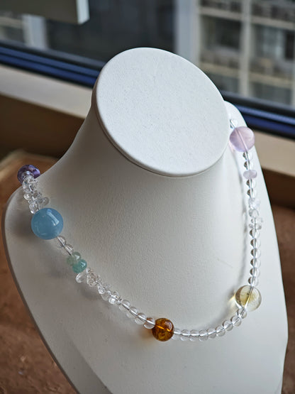 A multi-gemstone bracelet which is made with Silver Sheen Obsidian, Clear Quartz, Amethyst, Rose Quartz, Kyanite, Citrine, and Prehnite, etc. It’s also a necklace.