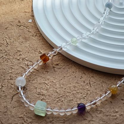 A multi-gemstone bracelet which is made with Silver Sheen Obsidian, Clear Quartz, Amethyst, Rose Quartz, Kyanite, Citrine, and Prehnite, etc. It’s also a necklace.