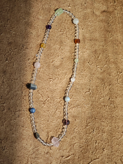 A multi-gemstone bracelet which is made with Silver Sheen Obsidian, Clear Quartz, Amethyst, Rose Quartz, Kyanite, Citrine, and Prehnite, etc. It’s also a necklace.