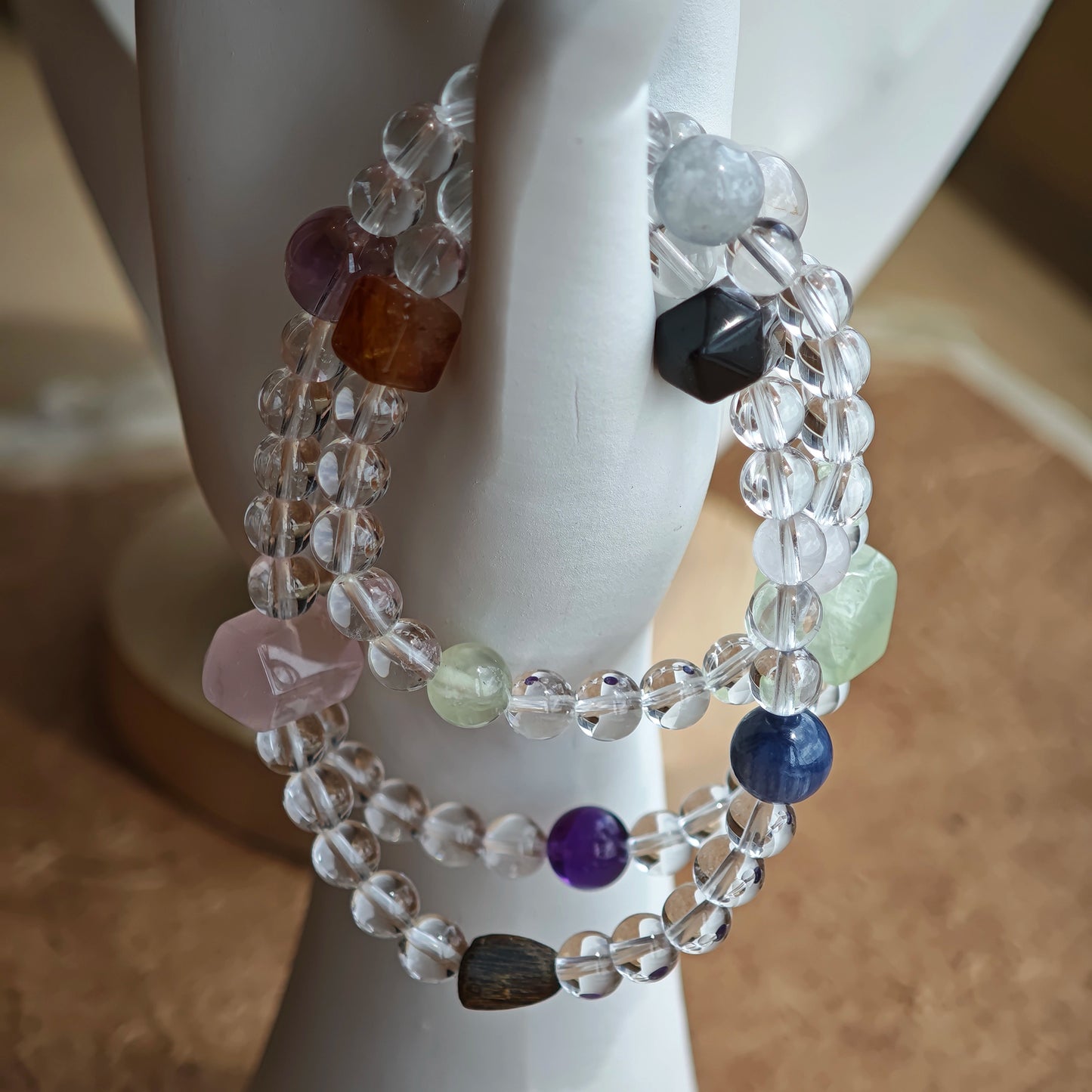 A multi-gemstone bracelet which is made with Silver Sheen Obsidian, Clear Quartz, Amethyst, Rose Quartz, Kyanite, Citrine, and Prehnite, etc. It’s also a necklace.