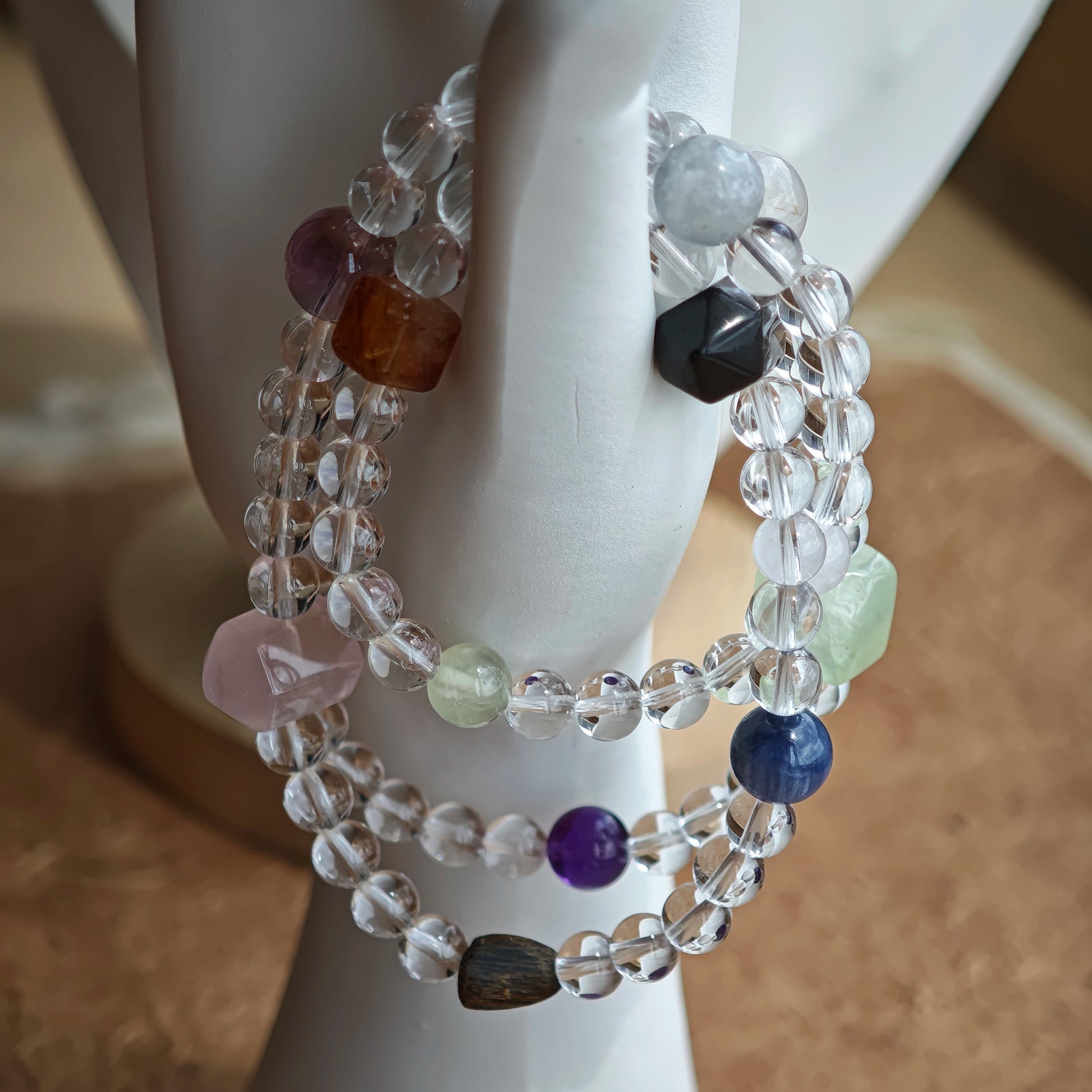 A multi-gemstone bracelet which is made with Silver Sheen Obsidian, Clear Quartz, Amethyst, Rose Quartz, Kyanite, Citrine, and Prehnite, etc. It’s also a necklace.