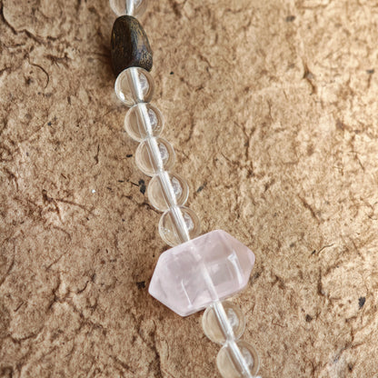 A multi-gemstone bracelet which is made with Silver Sheen Obsidian, Clear Quartz, Amethyst, Rose Quartz, Kyanite, Citrine, and Prehnite, etc. It’s also a necklace.