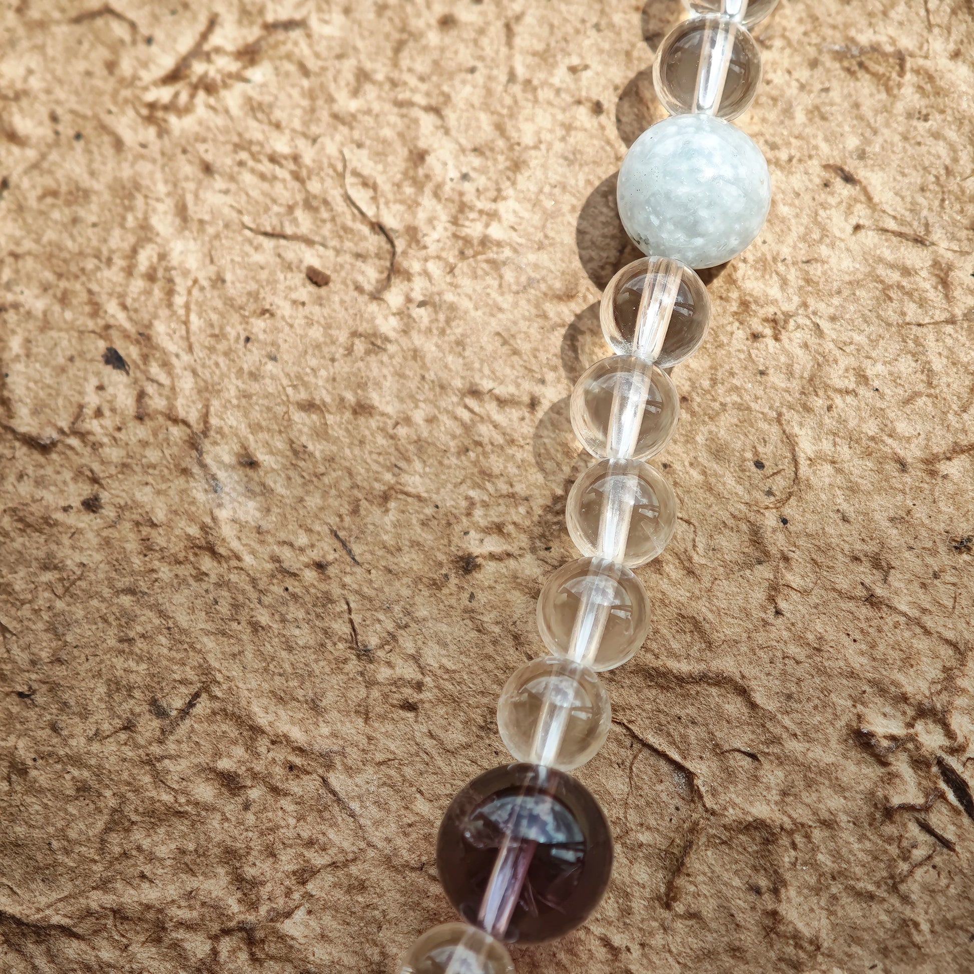 A multi-gemstone bracelet which is made with Silver Sheen Obsidian, Clear Quartz, Amethyst, Rose Quartz, Kyanite, Citrine, and Prehnite, etc. It’s also a necklace.