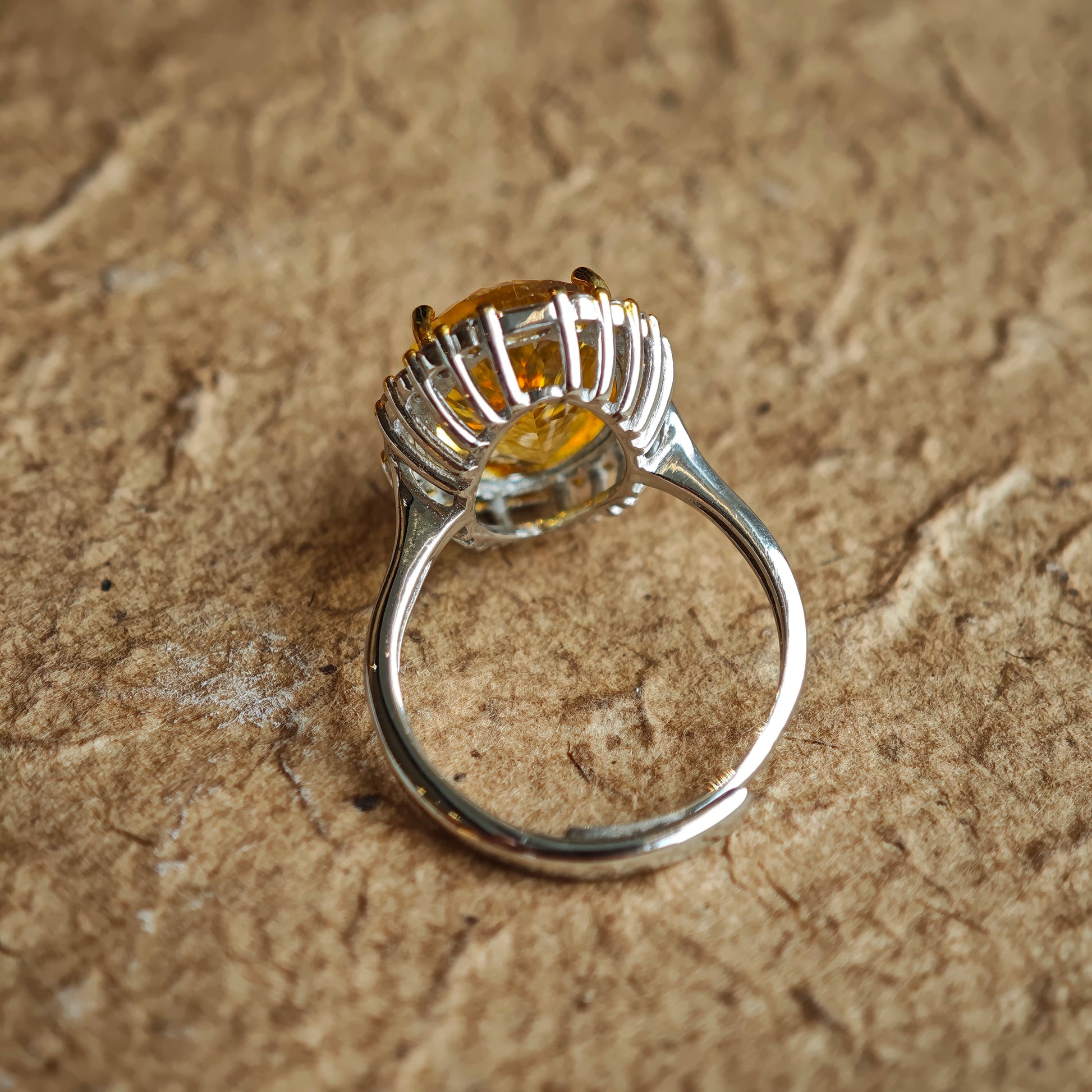 The stone’s 128-facet crown drinks in daylight and pours it back out in liquid gold flashes.