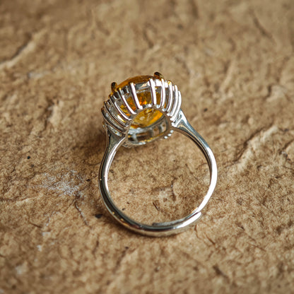 The stone’s 128-facet crown drinks in daylight and pours it back out in liquid gold flashes.