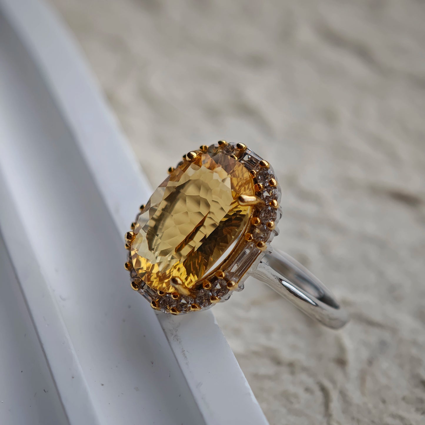 Each of the 128 cuts acts like a miniature prism, turning a single ray into a shower of amber sparks.