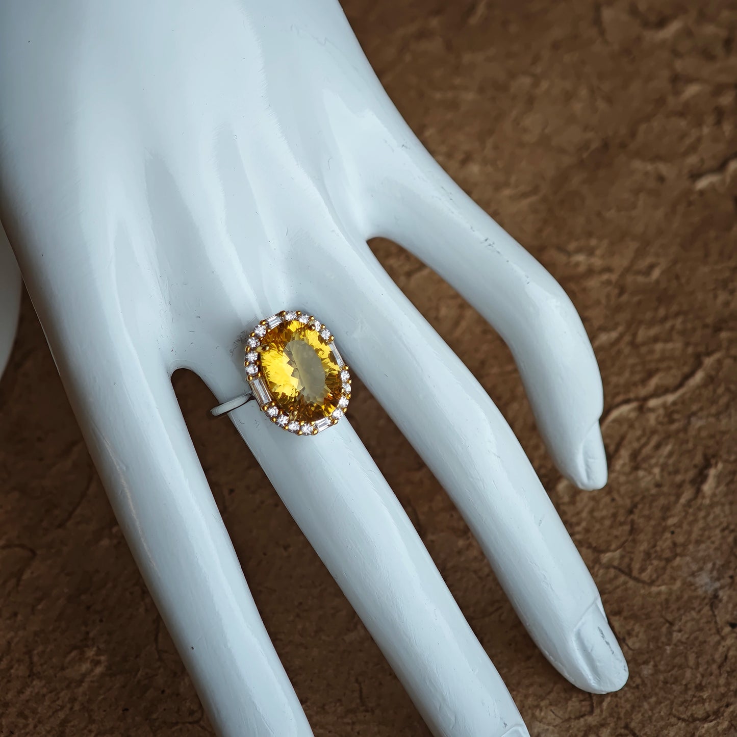 The citrine’s 128 facets are secret doorways; open them with a twist of the wrist and light floods out.