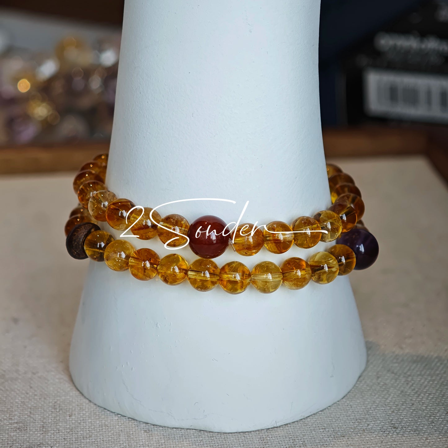 This is a layered bracelet consists of citrine beads, amethyst and aloeswood beads.