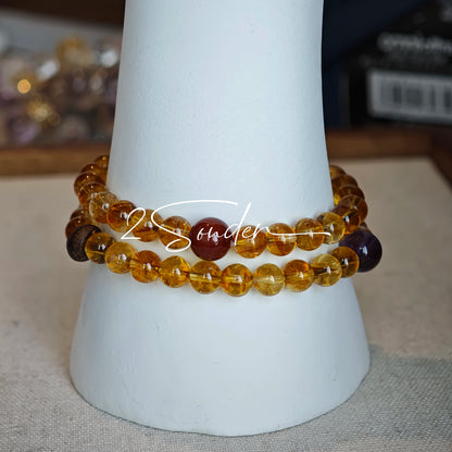 This is a layered bracelet consists of citrine beads, amethyst and aloeswood beads.