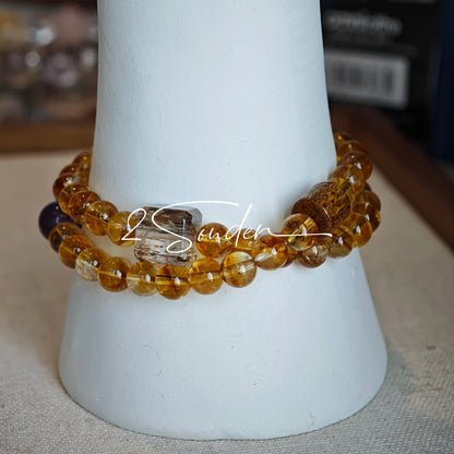 This is a layered bracelet consists of citrine beads, amethyst and aloeswood beads.