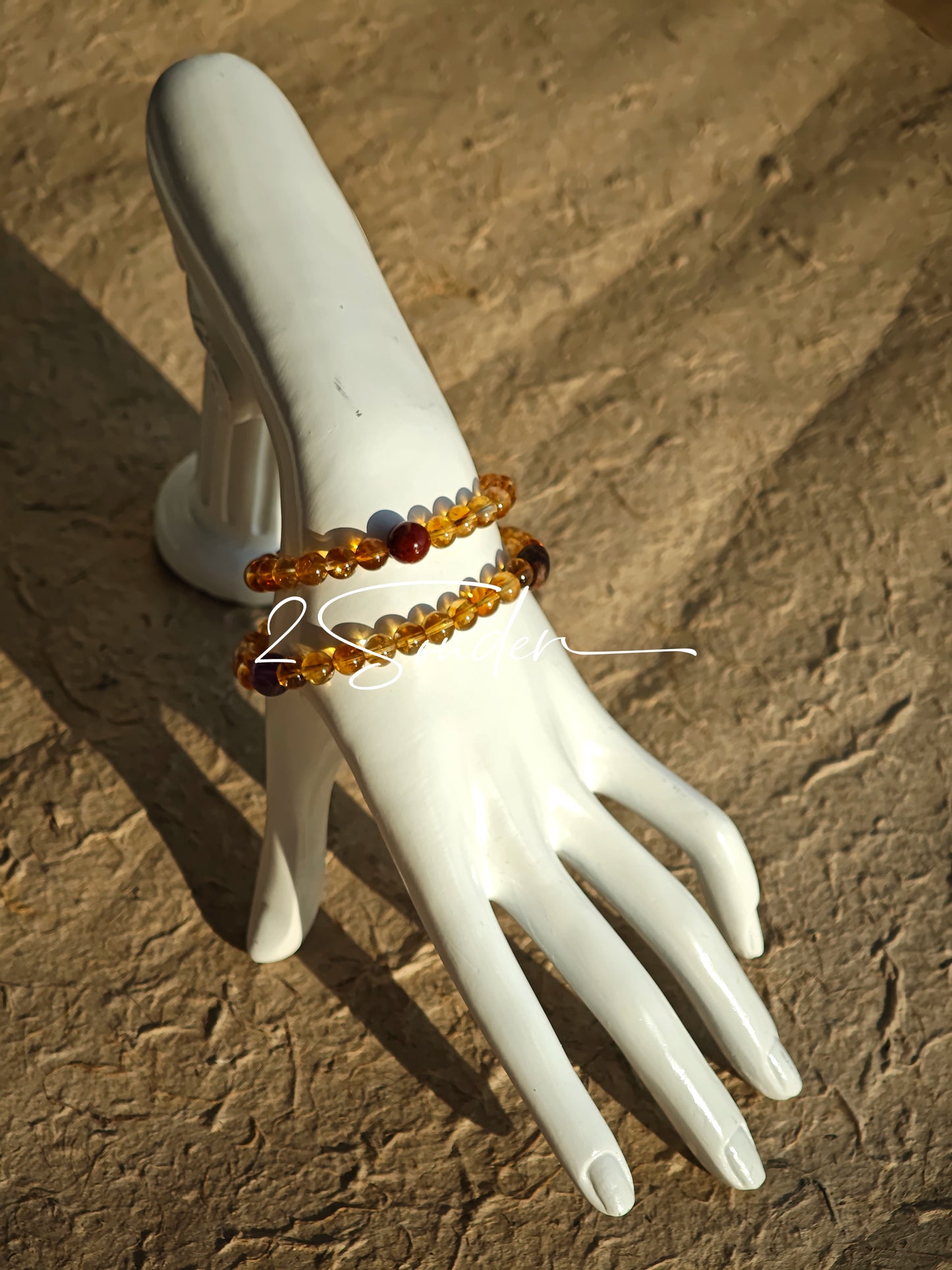 This is a layered bracelet consists of citrine beads, amethyst and aloeswood beads.