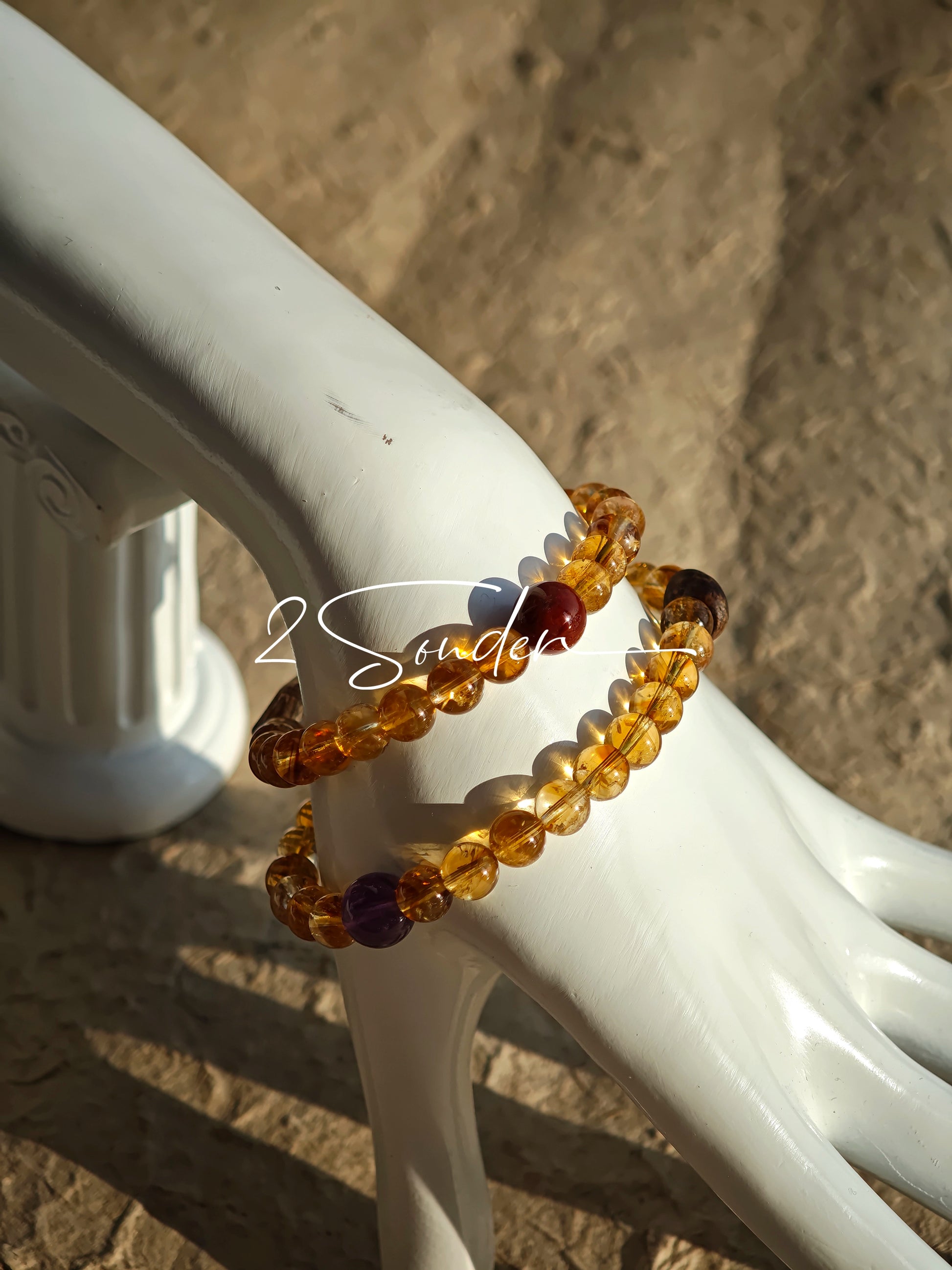 This is a layered bracelet consists of citrine beads, amethyst and aloeswood beads.