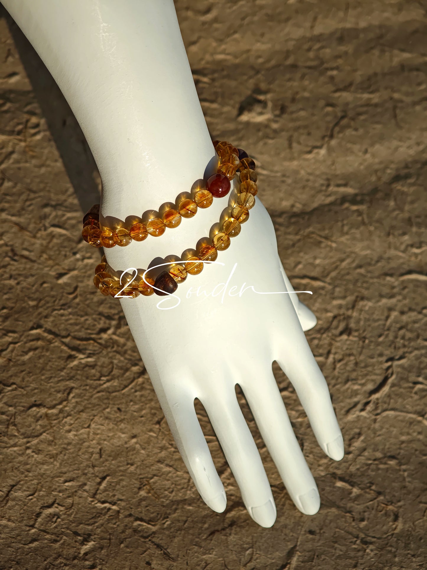 This is a layered bracelet consists of citrine beads, amethyst and aloeswood beads.