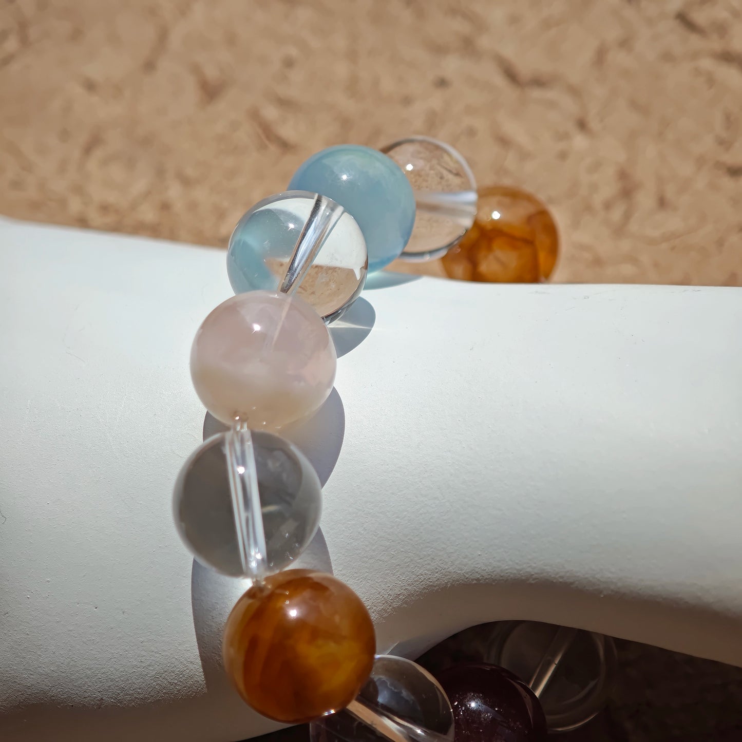 This exquisite piece features a curated blend of genuine crystals—from passionate Strawberry Quartz and tranquil Amethyst to the amplifying Clear Quartz—each selected for its unique beauty and energetic properties.