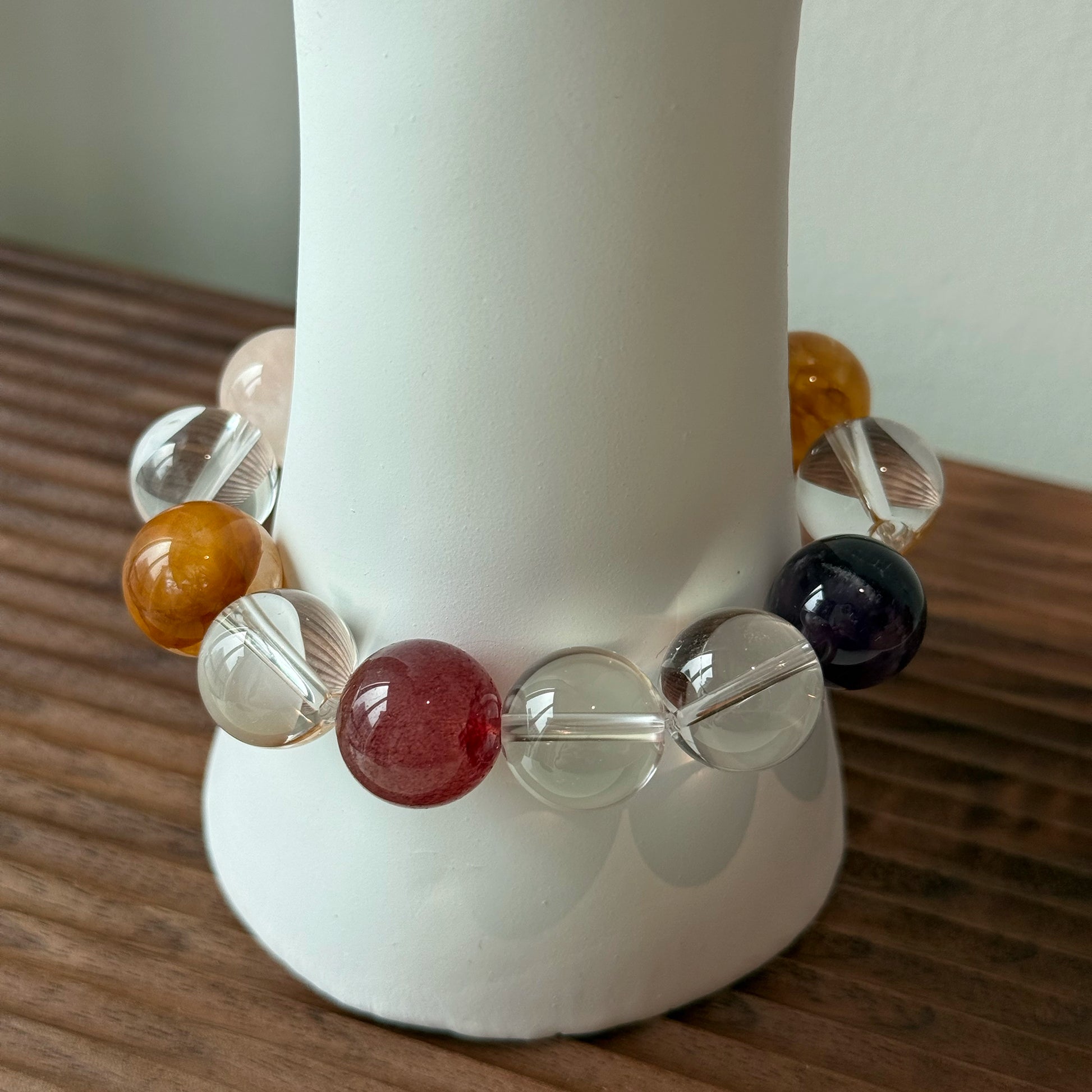 This exquisite piece features a curated blend of genuine crystals—from passionate Strawberry Quartz and tranquil Amethyst to the amplifying Clear Quartz—each selected for its unique beauty and energetic properties.