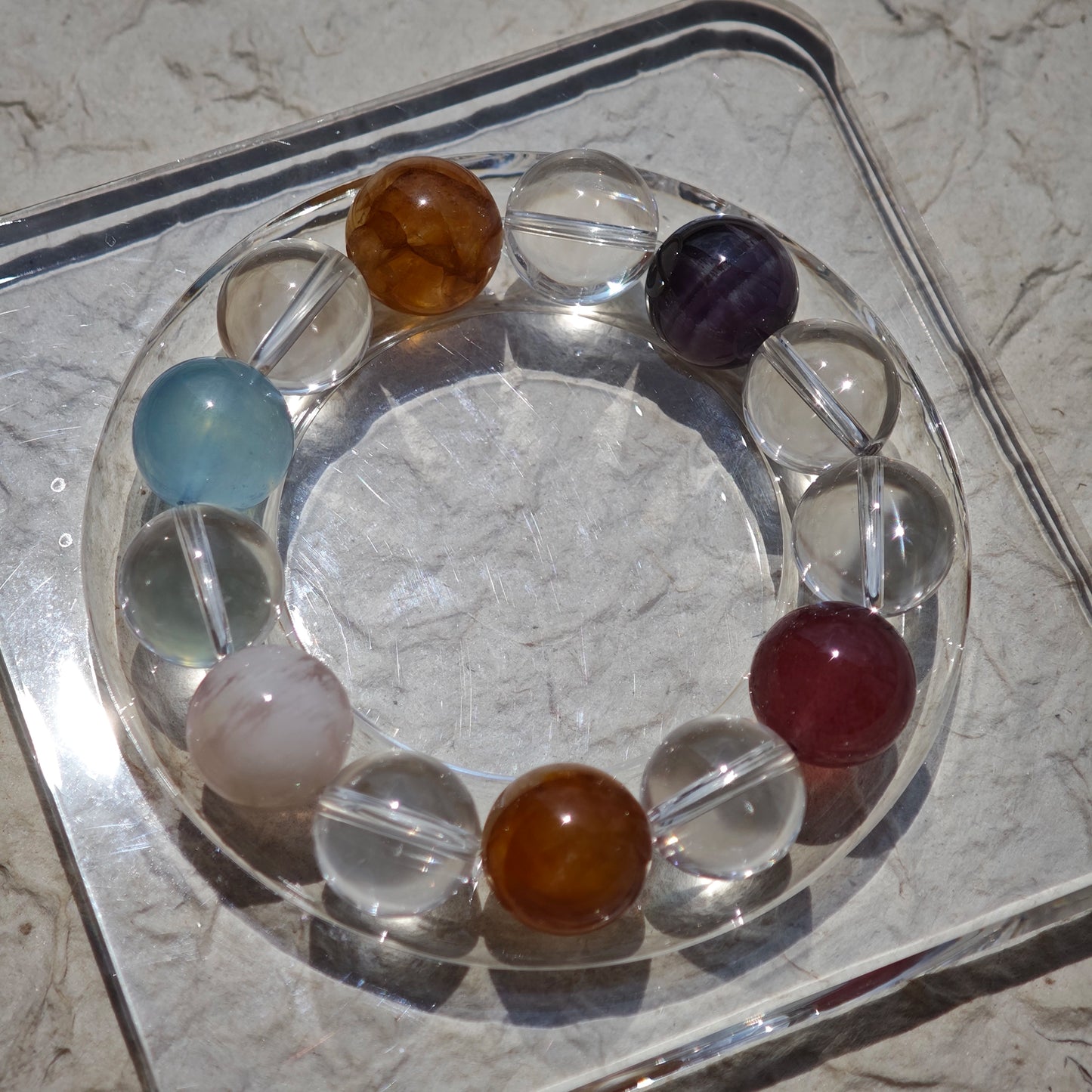 This exquisite piece features a curated blend of genuine crystals—from passionate Strawberry Quartz and tranquil Amethyst to the amplifying Clear Quartz—each selected for its unique beauty and energetic properties.