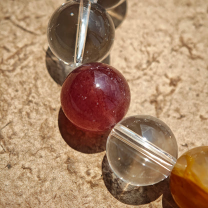 This exquisite piece features a curated blend of genuine crystals—from passionate Strawberry Quartz and tranquil Amethyst to the amplifying Clear Quartz—each selected for its unique beauty and energetic properties.