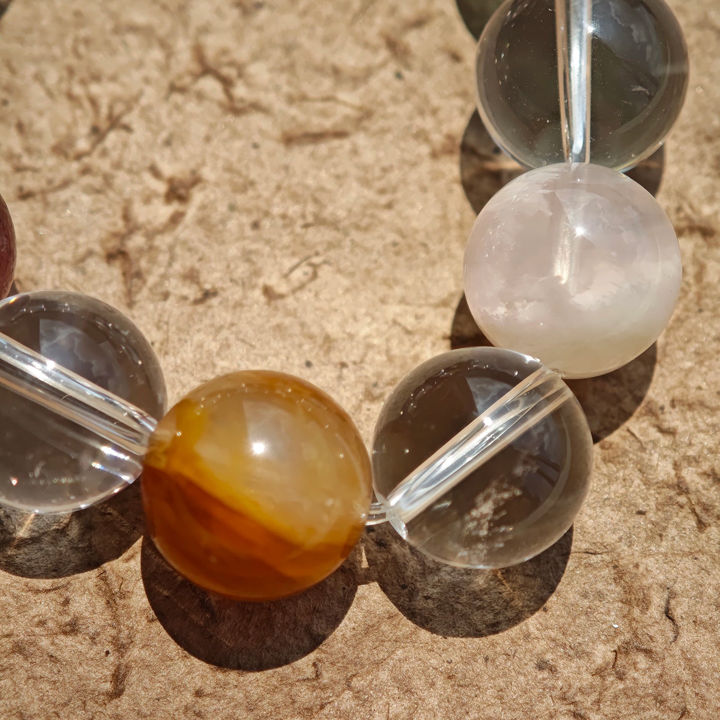 This exquisite piece features a curated blend of genuine crystals—from passionate Strawberry Quartz and tranquil Amethyst to the amplifying Clear Quartz—each selected for its unique beauty and energetic properties.